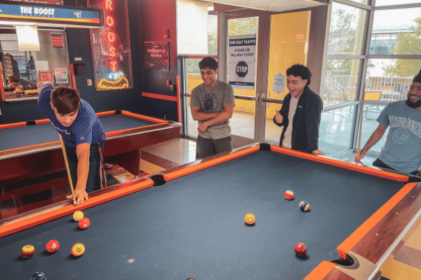 Students in the Roost Game Room